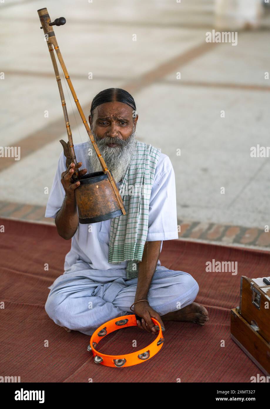 Lalon Devotee playing music in Mausoleum of Lalon Shah, Khulna Division ...