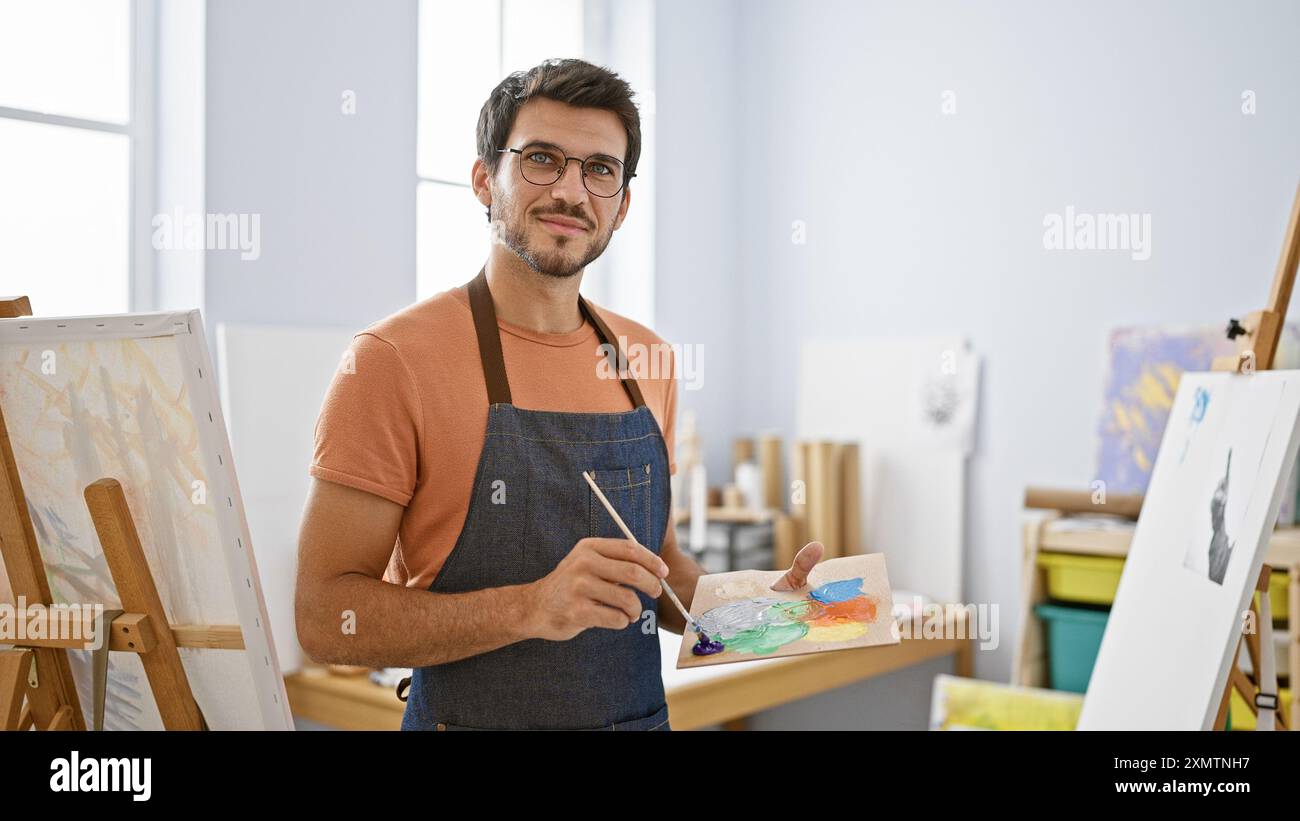 Focused young man paints hi-res stock photography and images - Alamy