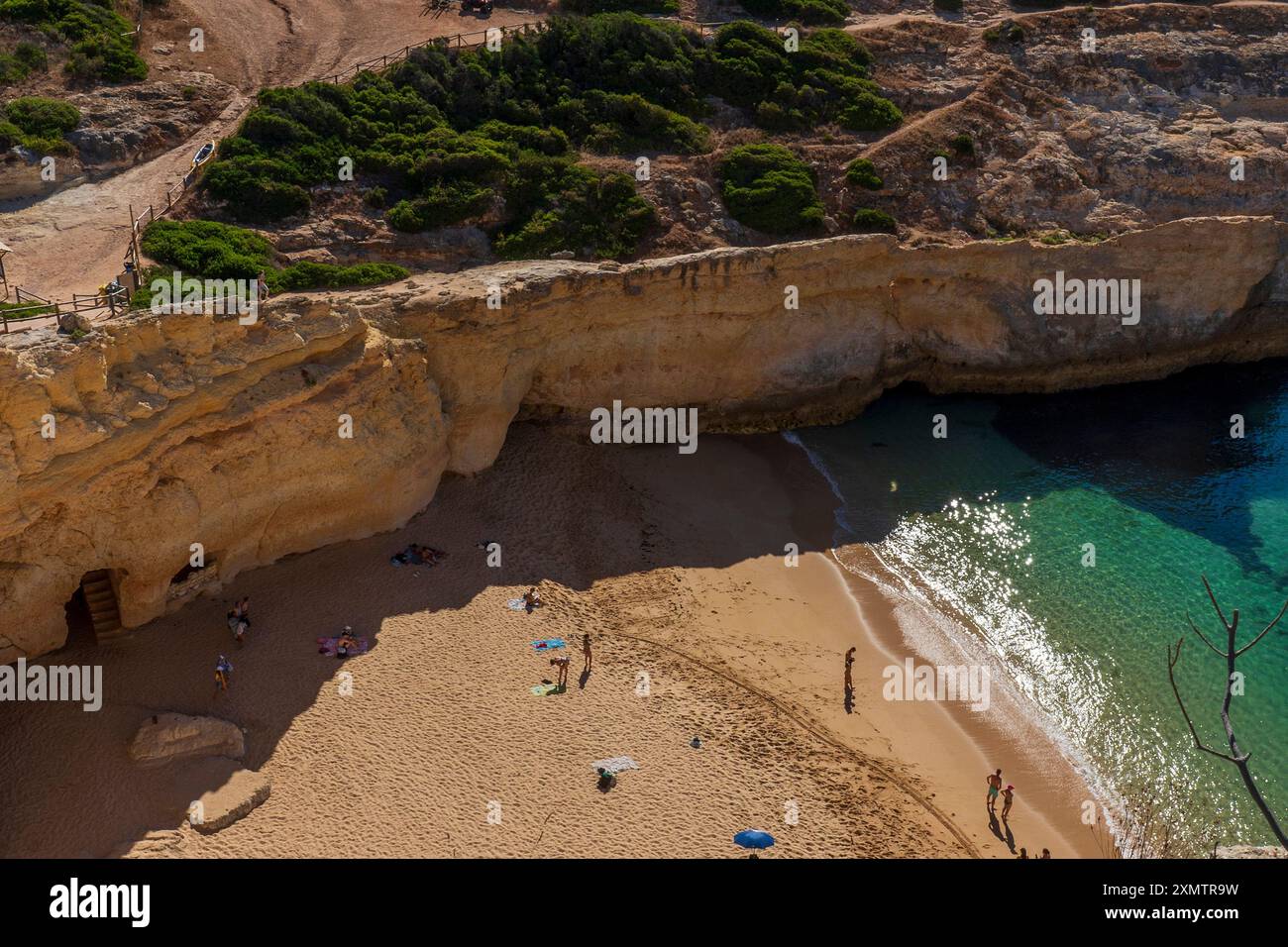 People on the Sand at Carvalho Beach as seen from the Seven Hanging Valleys Trail, Carvoeiro Beaches, The Algarve, Southern Portugal. Stock Photo