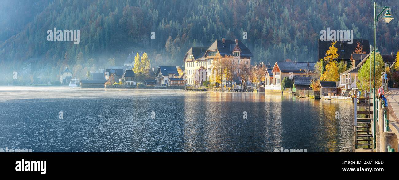 Stunning foggy autumn sunrise on famous Hallstatt mountain village with ...