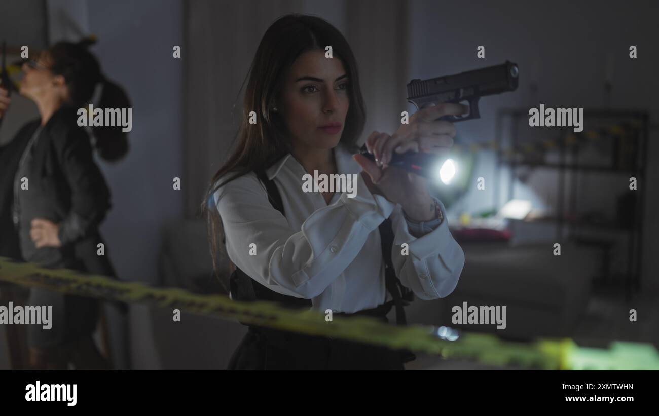 Two women investigators scrutinize a crime scene indoors with a gun and ...