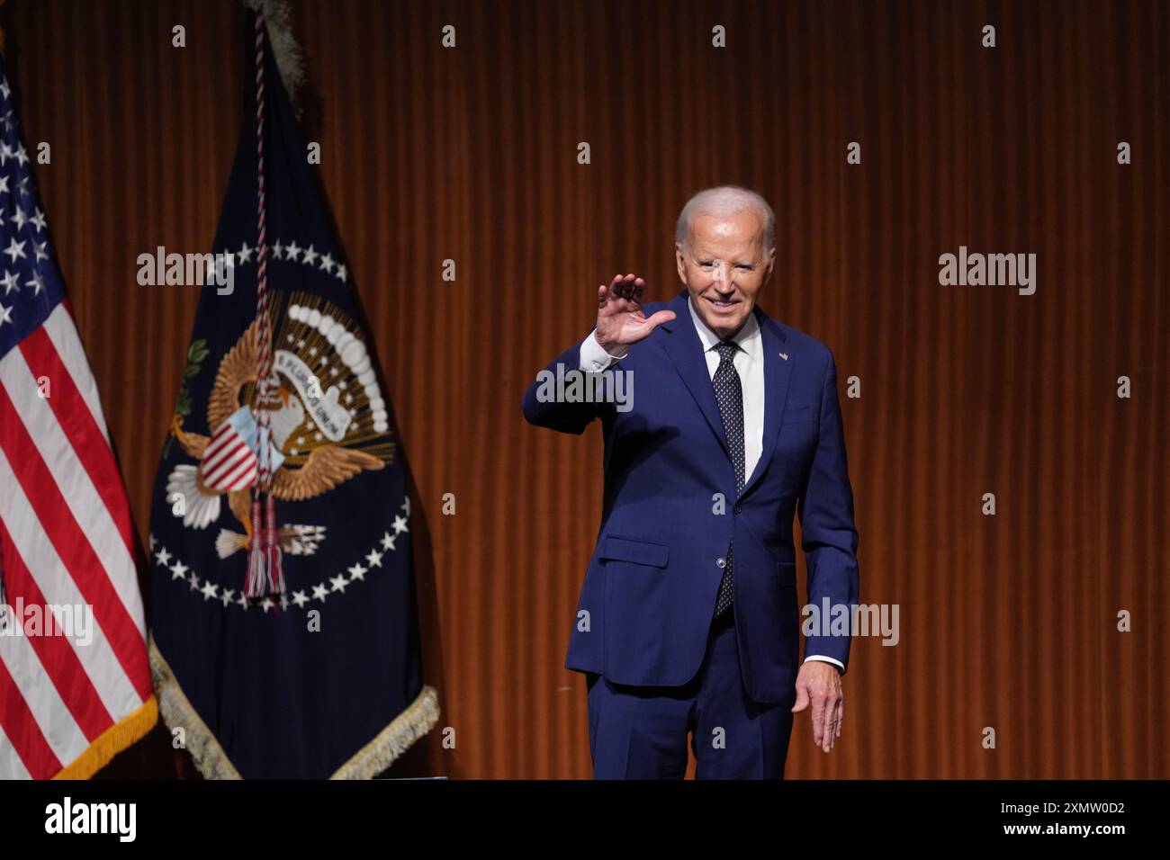 U.S. President JOE BIDEN leaves the stage after giving the keynote ...