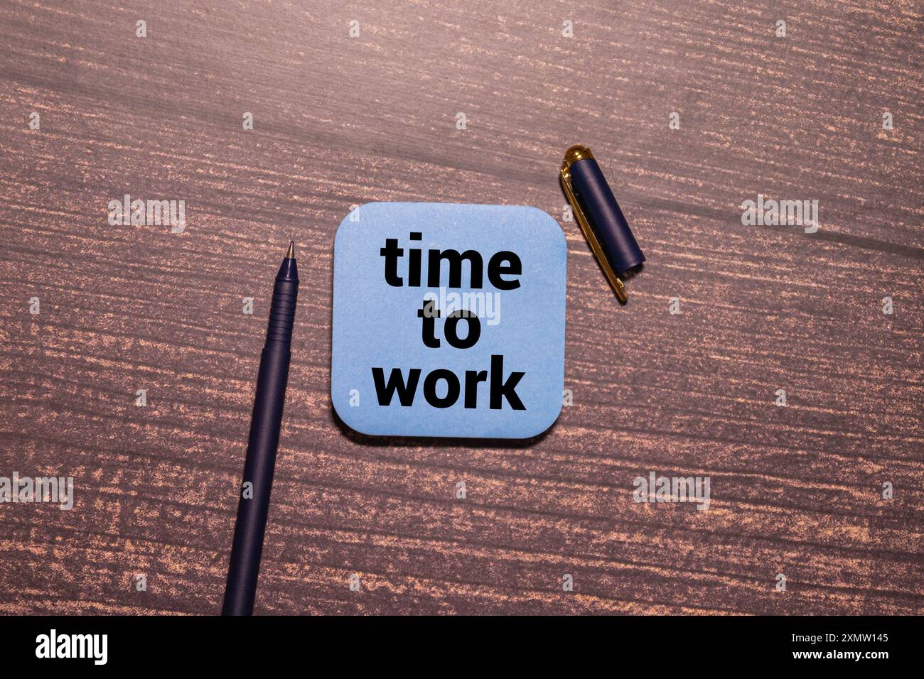 Time to work text on clock Stock Photo - Alamy