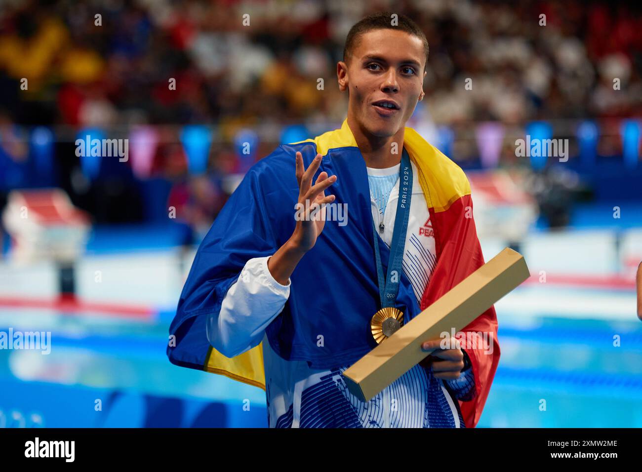 David Popovici of Romania celebrates his gold medal during the Men
