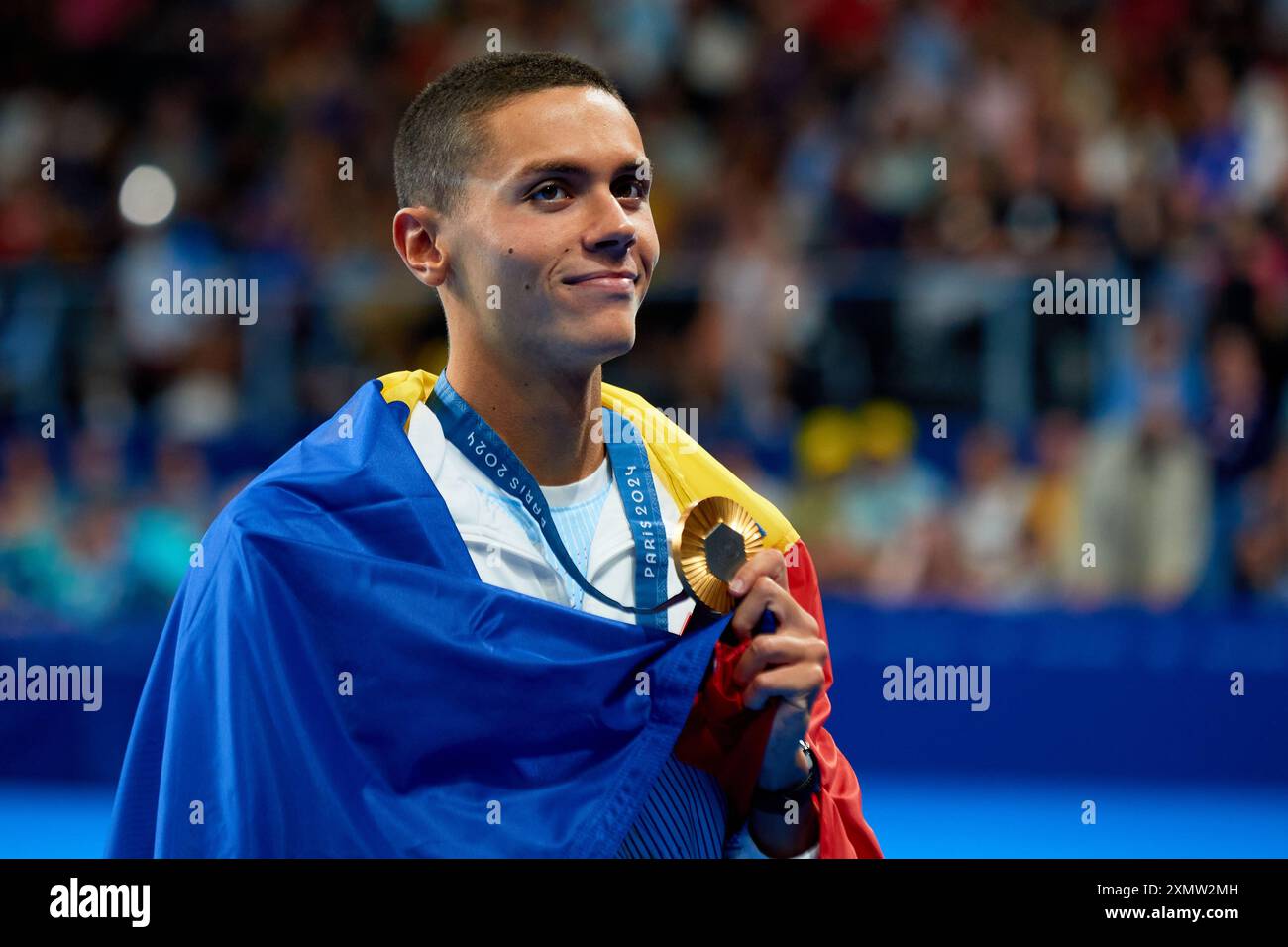 David Popovici of Romania celebrates his gold medal during the Men