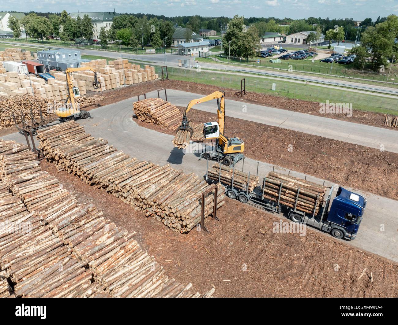 Wood sawmill, machinery for processing wood. Processing plant. A worker ...
