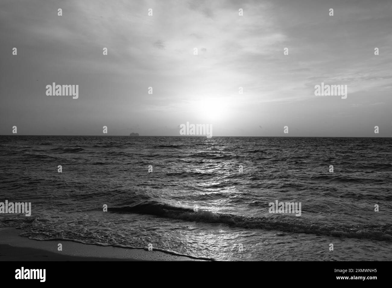 beautiful sunrise sky with waves on sea water Stock Photo - Alamy