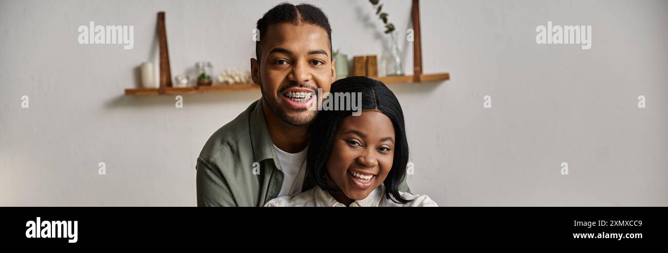 A happy African American couple smiles warmly at the camera Stock Photo ...