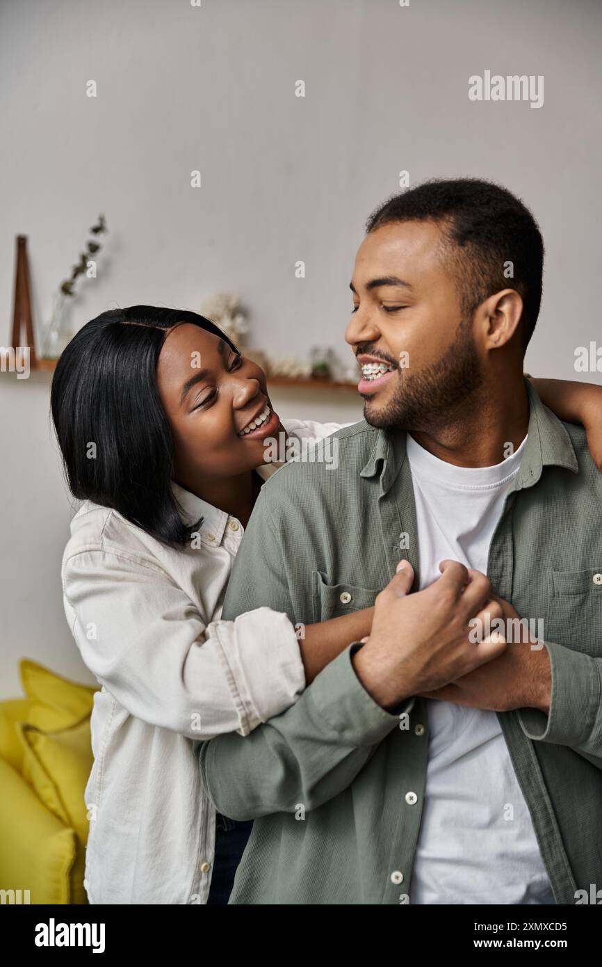 A loving African American couple embraces at home Stock Photo - Alamy