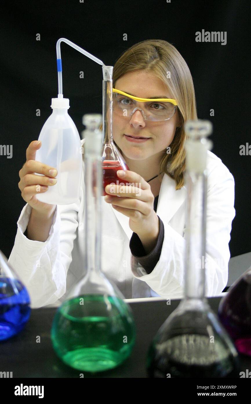 A researcher of chemistry doing a science experiment in the lab. Stock Photo
