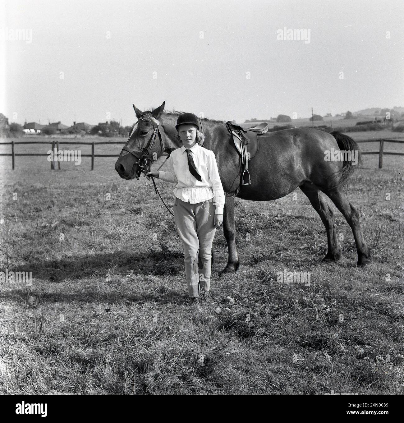 1960s, historical, equestrian, a young girl in riding grear, jodhpurs ...
