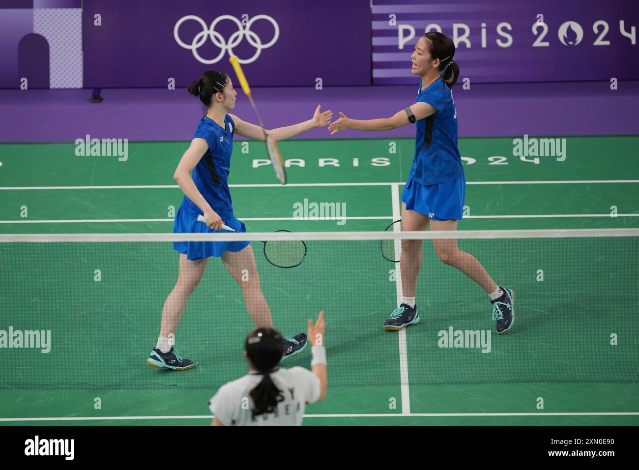 South Korea's Kim So-yeing throws a racket as she play against Japan's ...