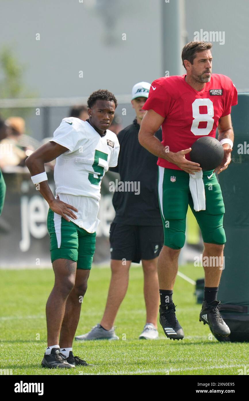 New York Jets quarterback Aaron Rodgers 8 right and Garrett Wilson 5 participates in a practice