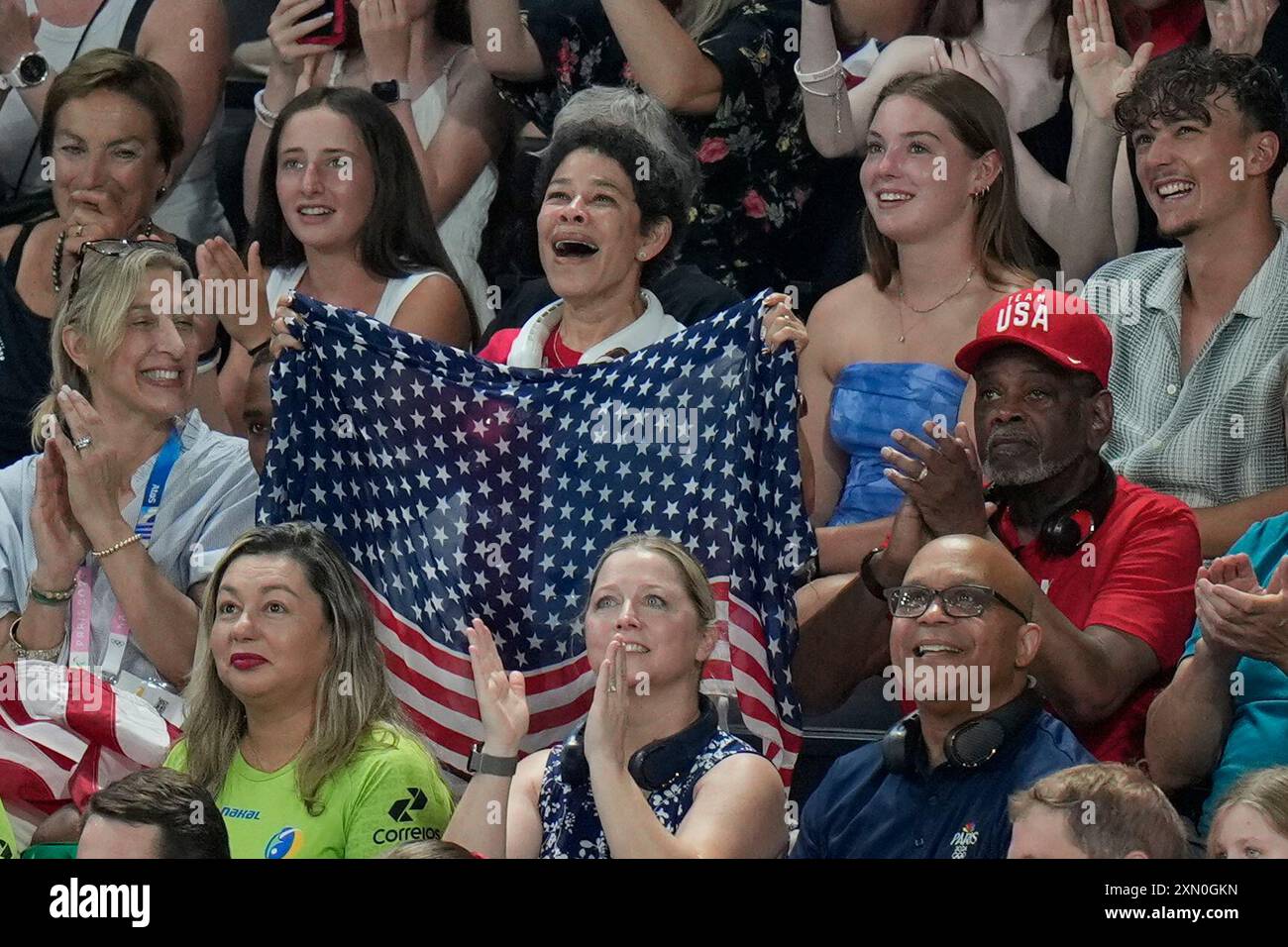 Simone Biles' mother Nellie Biles cheers as her daughter is introduced