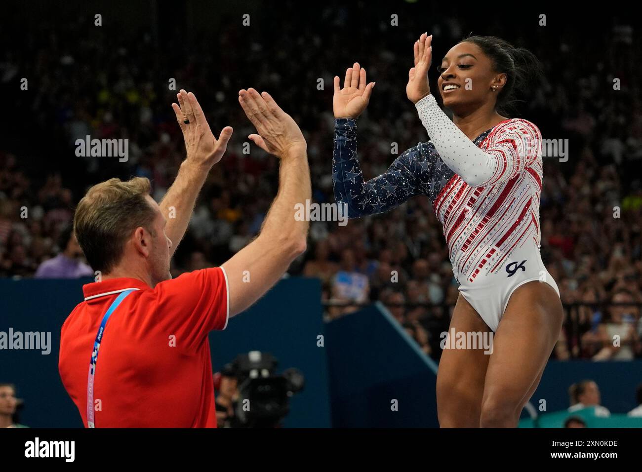 Simone Biles, of the United States, celebrates after performing on the ...