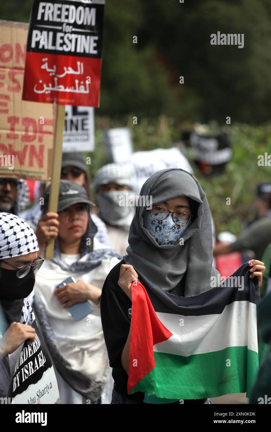 July 30, 2024, Shenstone, England, UK: Protesters demonstrate outside the UAV Engines factory with signs and Palestinian flags. Protesters demand that UAV Engines stop producing parts for drones that are being used against the Palestinian people in Gaza and elsewhere. Israeli bombing in Gaza has killed over 35,000 Palestinians since October 2023. Protesters including supporters of Pro-Palestinian group Palestine Action are determined to relentlessly target Elbit and their partner companies by regular protest and direct action and make business for them in the UK impossible. (Credit Image: © Ma Stock Photo