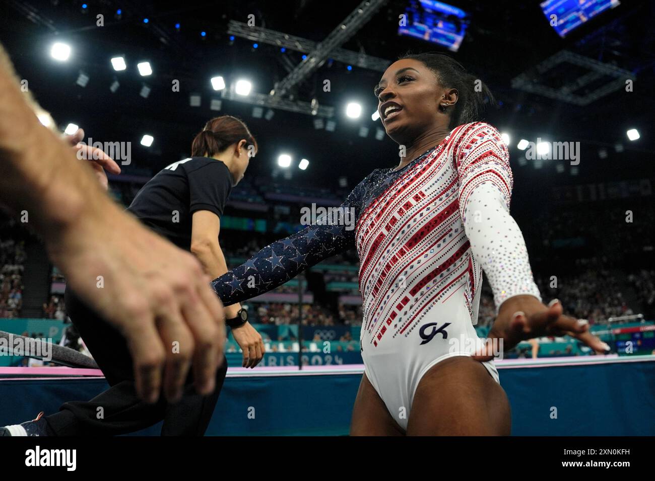 Simone Biles, of the United States, celebrates after performing on the ...
