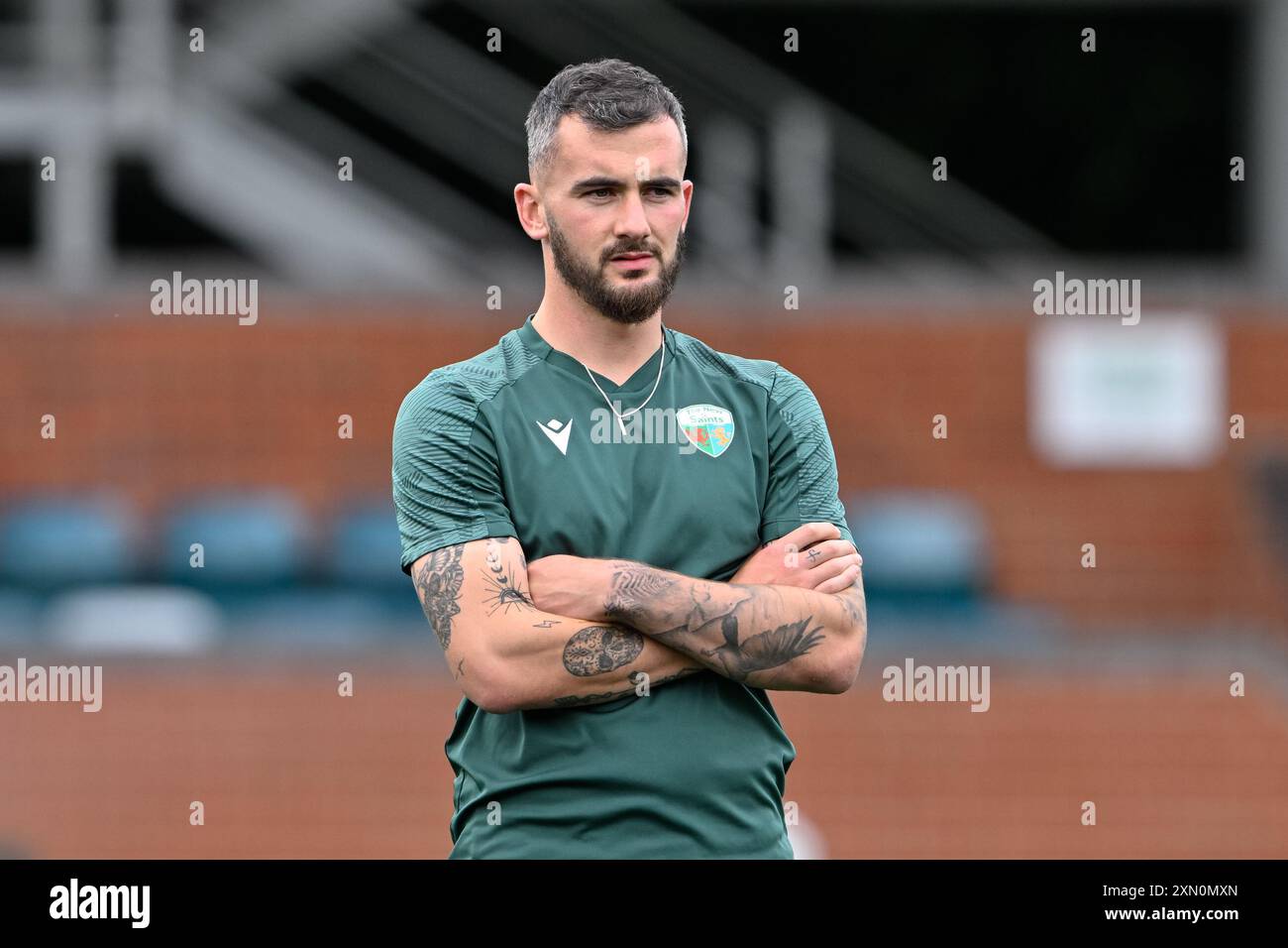 Leo Smith of The New Saints inspects the pitch ahead of the UEFA ...