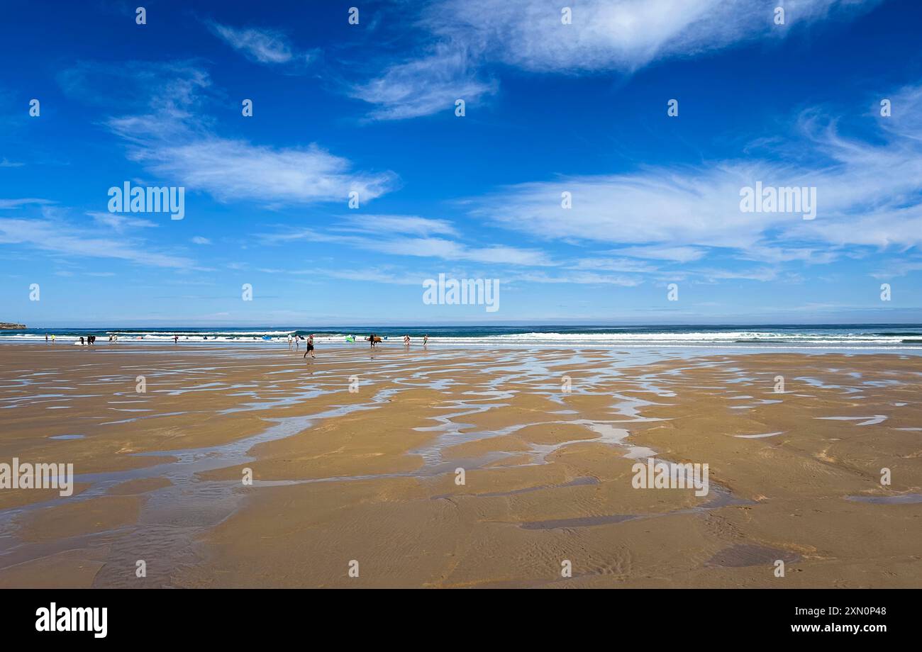 Panoramic view of the beach of Gerra, with blue sky and white clouds ...
