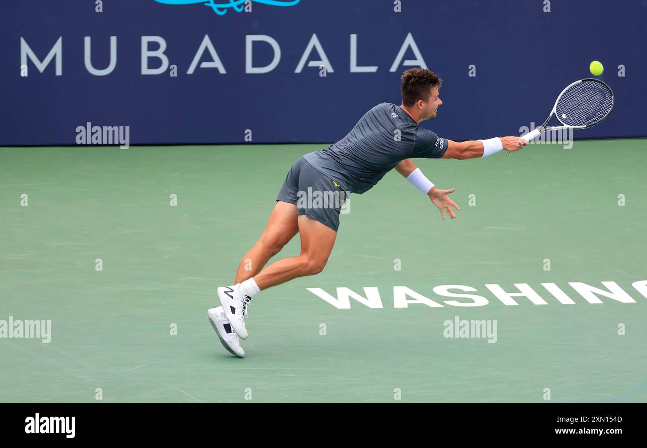 July 30, 2024: J.J. Wolf (USA) stretches for a back hand during 