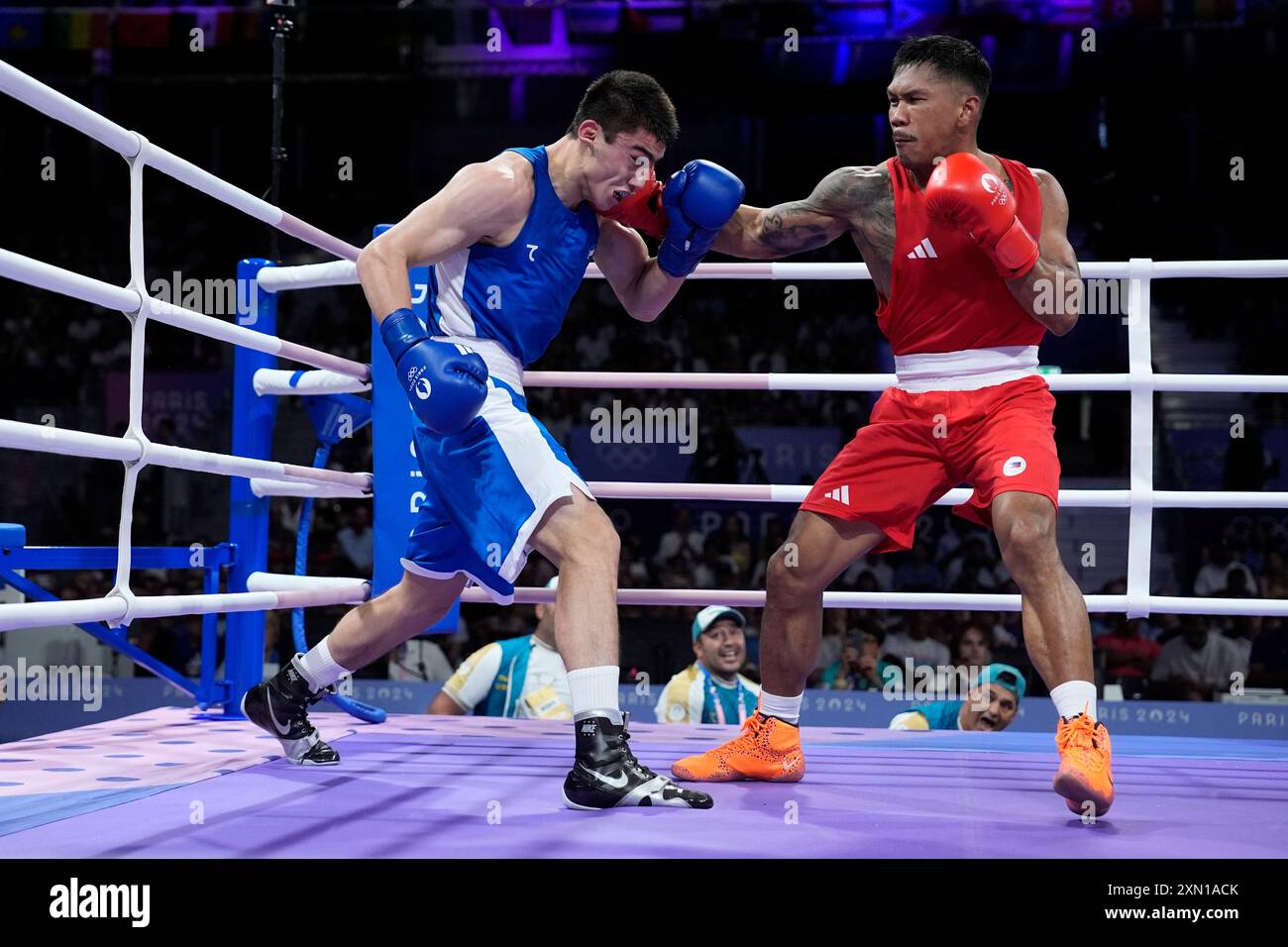 Philippines' Eumir Marcial, right, fights Uzbekistan's Turabek