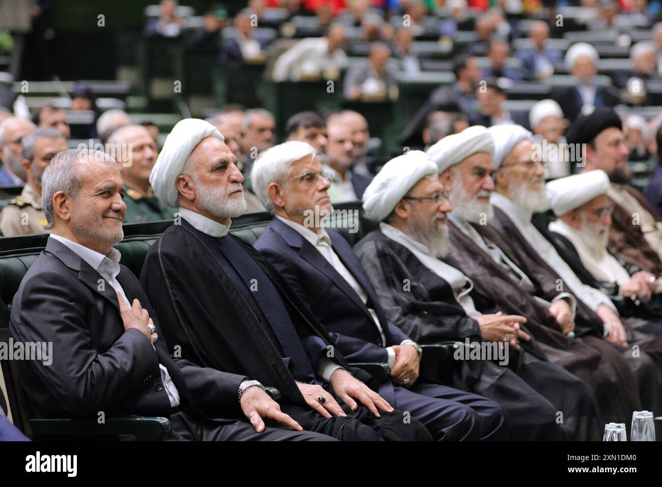 Tehran, Iran. 30th July, 2024. Iran's President-elect, MASOUD PEZESHKIAN (L), Iranian Judiciary Chief GHOLAM HOSSEIN MOHSENI EJEI (2L), Iranian First Vice President MOHAMMAD REZA AREF (3L), and other officials attend the swearing-in ceremony for the new Iranian president in Tehran. Masoud Pezeshkian was inaugurated as the new Iranian president on 30 July. (Credit Image: © Iranian Presidency via ZUMA Press Wire) EDITORIAL USAGE ONLY! Not for Commercial USAGE! Stock Photo