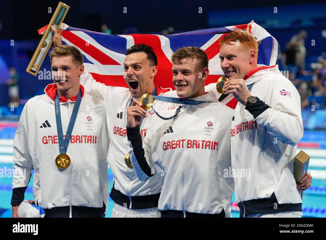 britain-s-men-s-4x200-meter-freestyle-relay-team-pose-with-their-gold