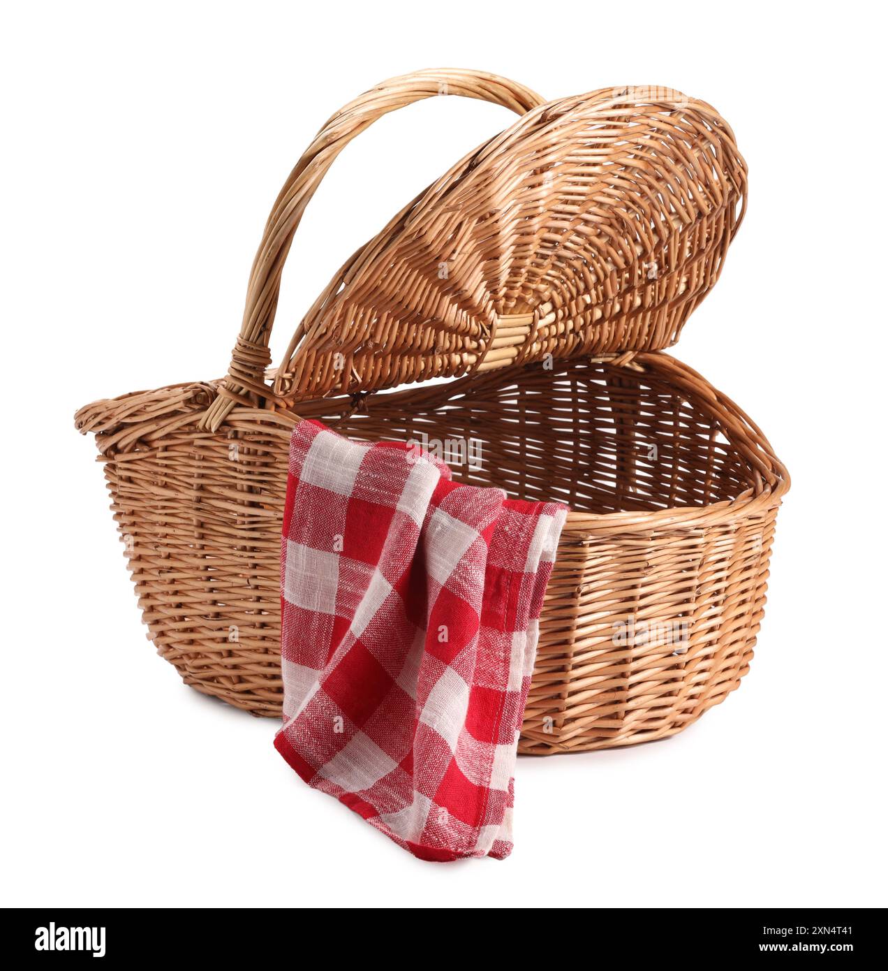 One open picnic wicker basket with checkered napkin isolated on white ...