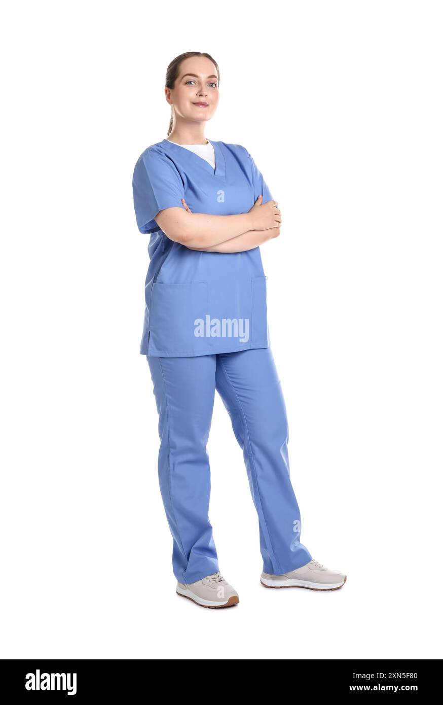Full length portrait of professional nurse in uniform on white ...