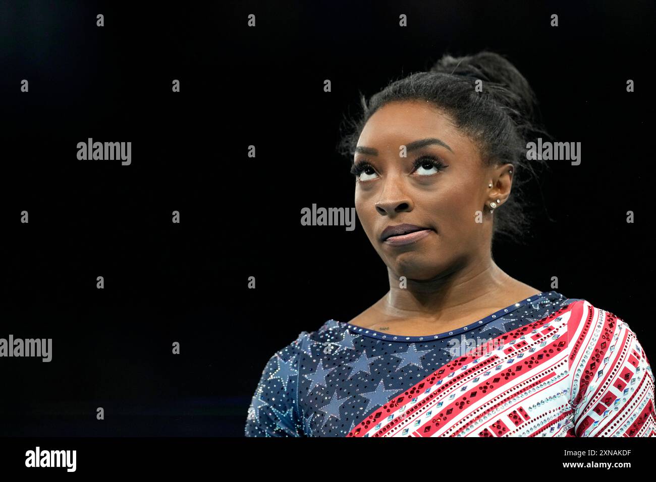 Simone Biles, of the United States, waits to compete during the women's ...