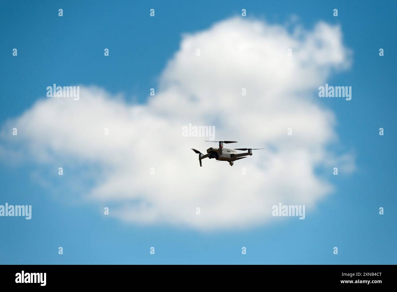 Drone on the Clouded Sky Stock Photo