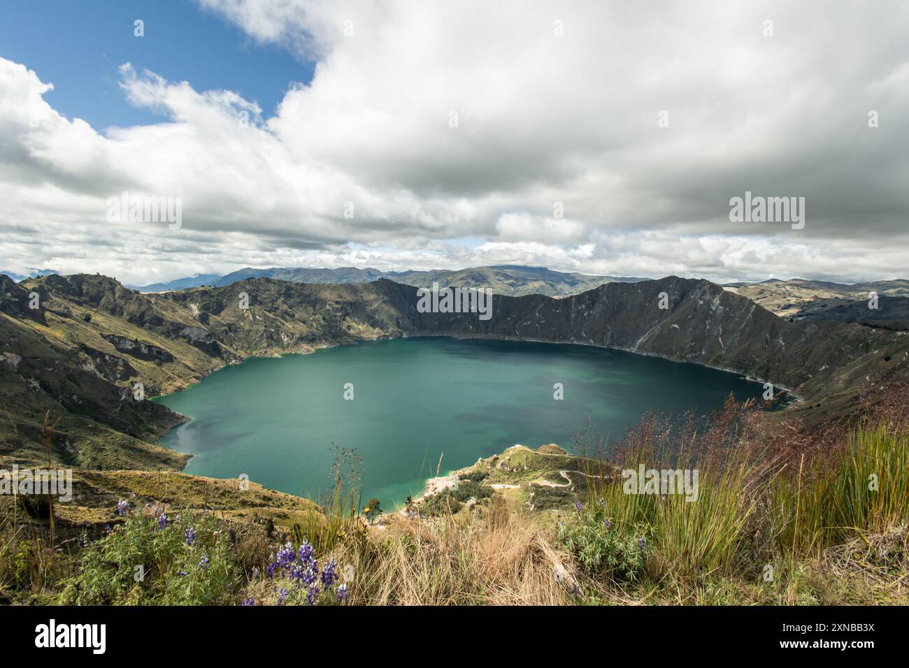 Quilotoa Lagoon, located at an altitude of 3,914 meters in the Ecuadorian Andes, features vibrant turquoise waters. captures the lagoon’s striking col Stock Photo