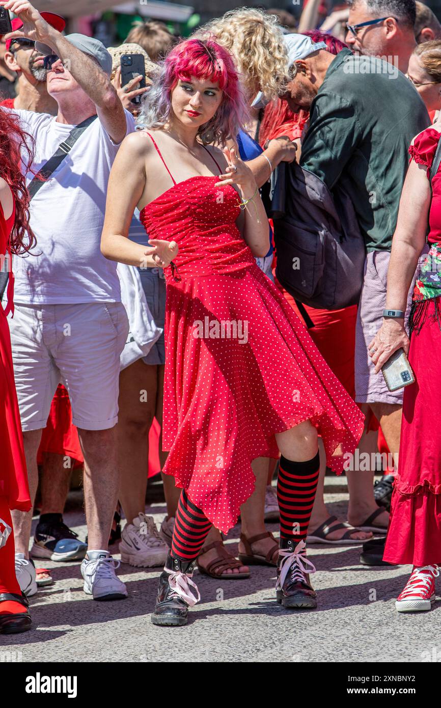 A young woman in a red dress dancing on Folkestone's Harbour Arm for ...