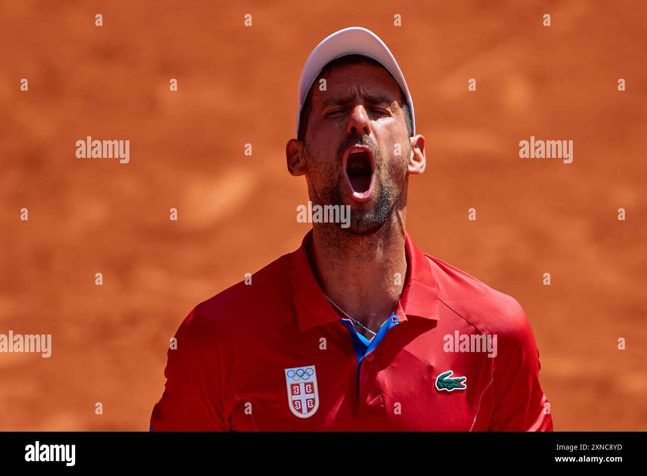 Paris, France. July 31, 2024, Novak Djokovic of Team Serbia celebrates winning match point against Dominik Koepfer of Team Germany during the Men's Singles Third Round match on day five of the Olympic Games Paris 2024 at Roland Garros on July 31, 2024 in Paris, France. Stock Photo