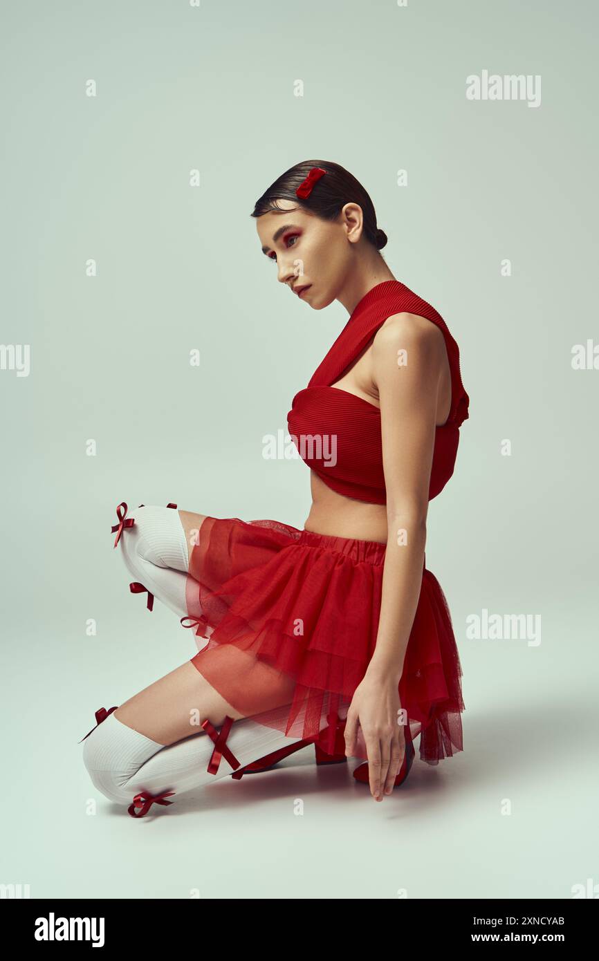 Woman in mini skirt sitting hi-res stock photography and images - Alamy