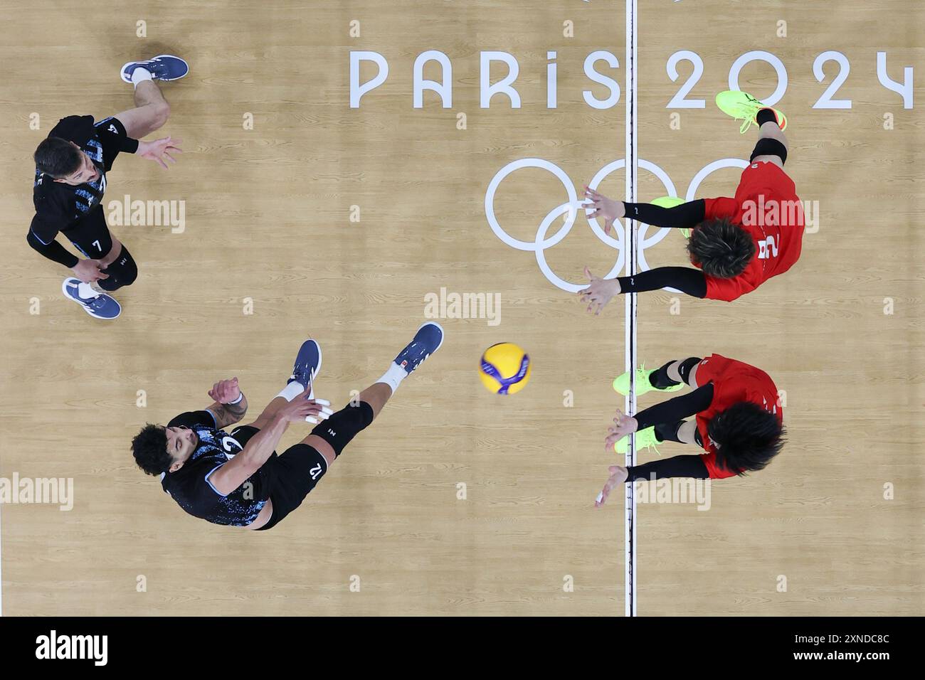 Paris, France. 31st July, 2024. Bruno Lima (2nd L) of Argentina spikes during the men's preliminary round pool C match of volleyball between Japan and Argentina at the Paris 2024 Olympic Games in Paris, France, July 31, 2024. Credit: Xu Zijian/Xinhua/Alamy Live News Stock Photo
