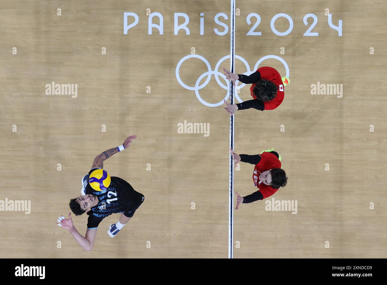 Paris, France. 31st July, 2024. Bruno Lima (L) of Argentina spikes during the men's preliminary round pool C match of volleyball between Japan and Argentina at the Paris 2024 Olympic Games in Paris, France, July 31, 2024. Credit: Xu Zijian/Xinhua/Alamy Live News Stock Photo