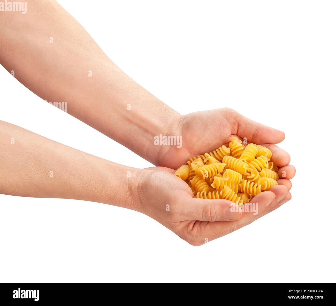pasta eliche in hand path isolated on white Stock Photo