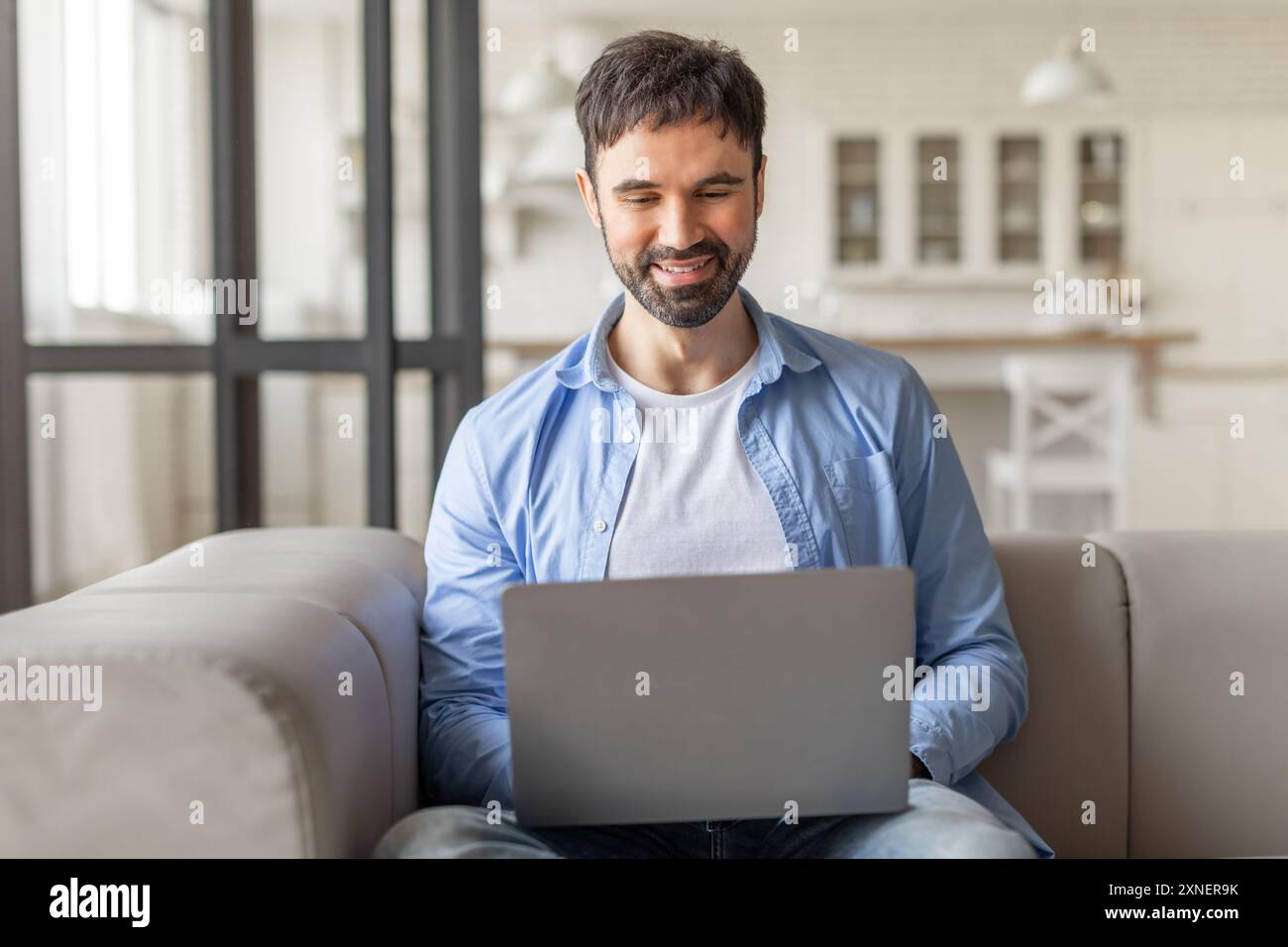 Man uses laptop typing home hi-res stock photography and images - Alamy