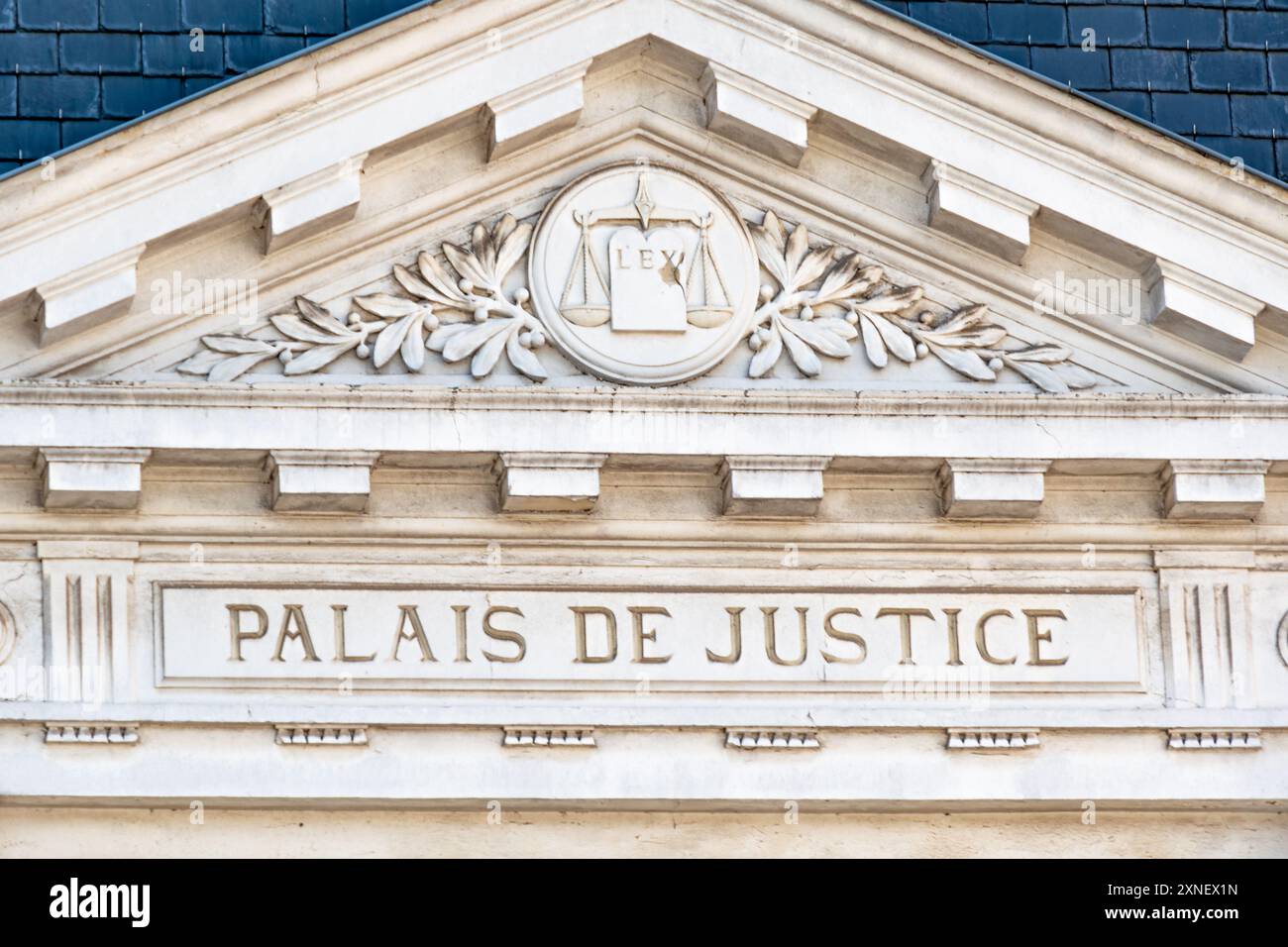 Justice Written Sign on the pediment of the facade of a courthouse with the words ...