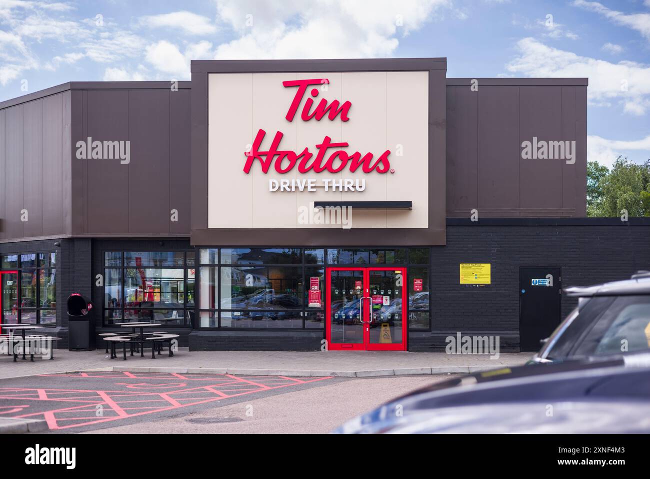 WATFORD, UK - July 10, 2024. Exterior of Tim Hortons Drive Thru coffeehouse and restaurant in London, England Stock Photo