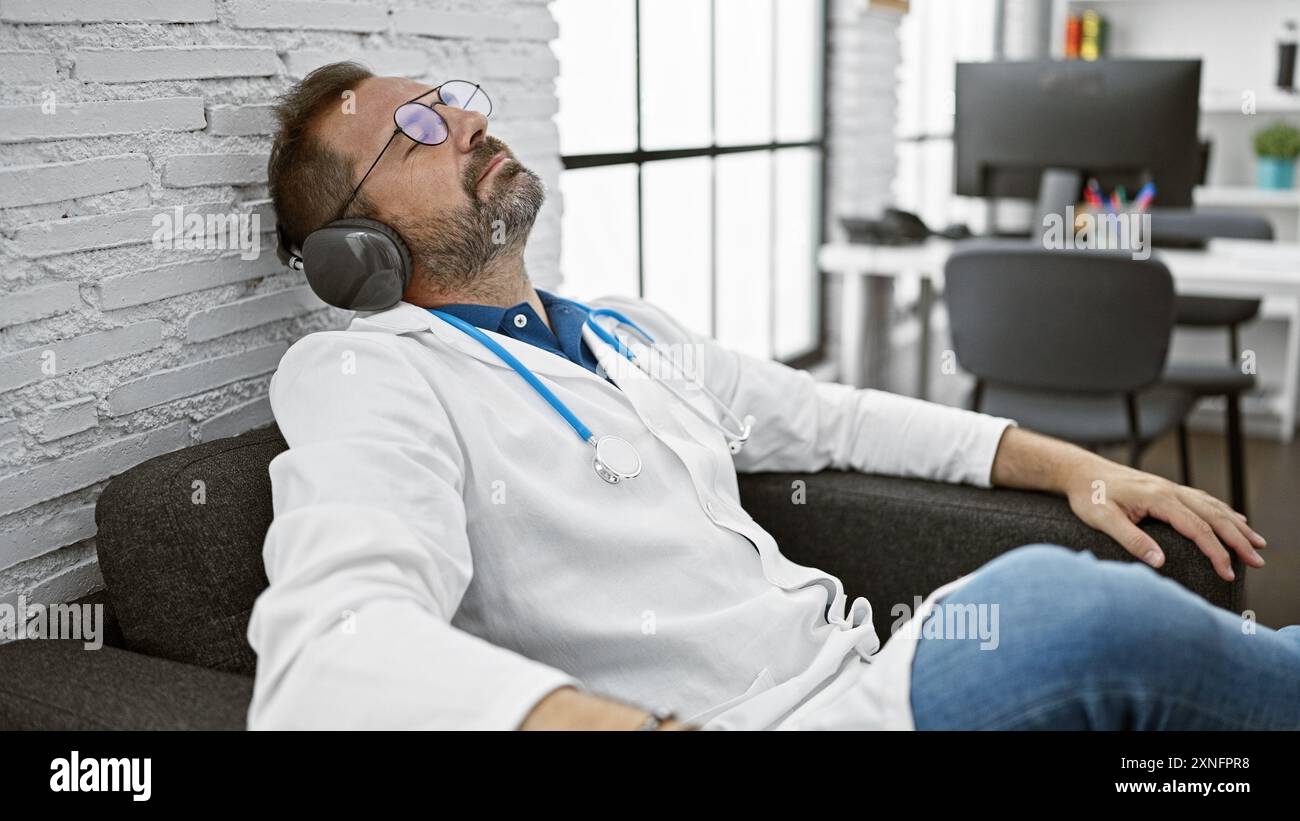 Hispanic doctor relaxes with headphones in a clinic office, portraying ...