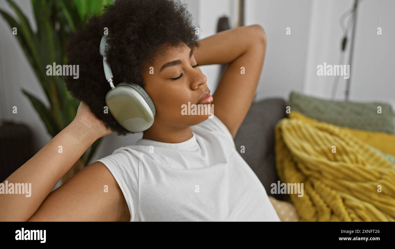 Relaxed african woman enjoys music hi-res stock photography and images ...