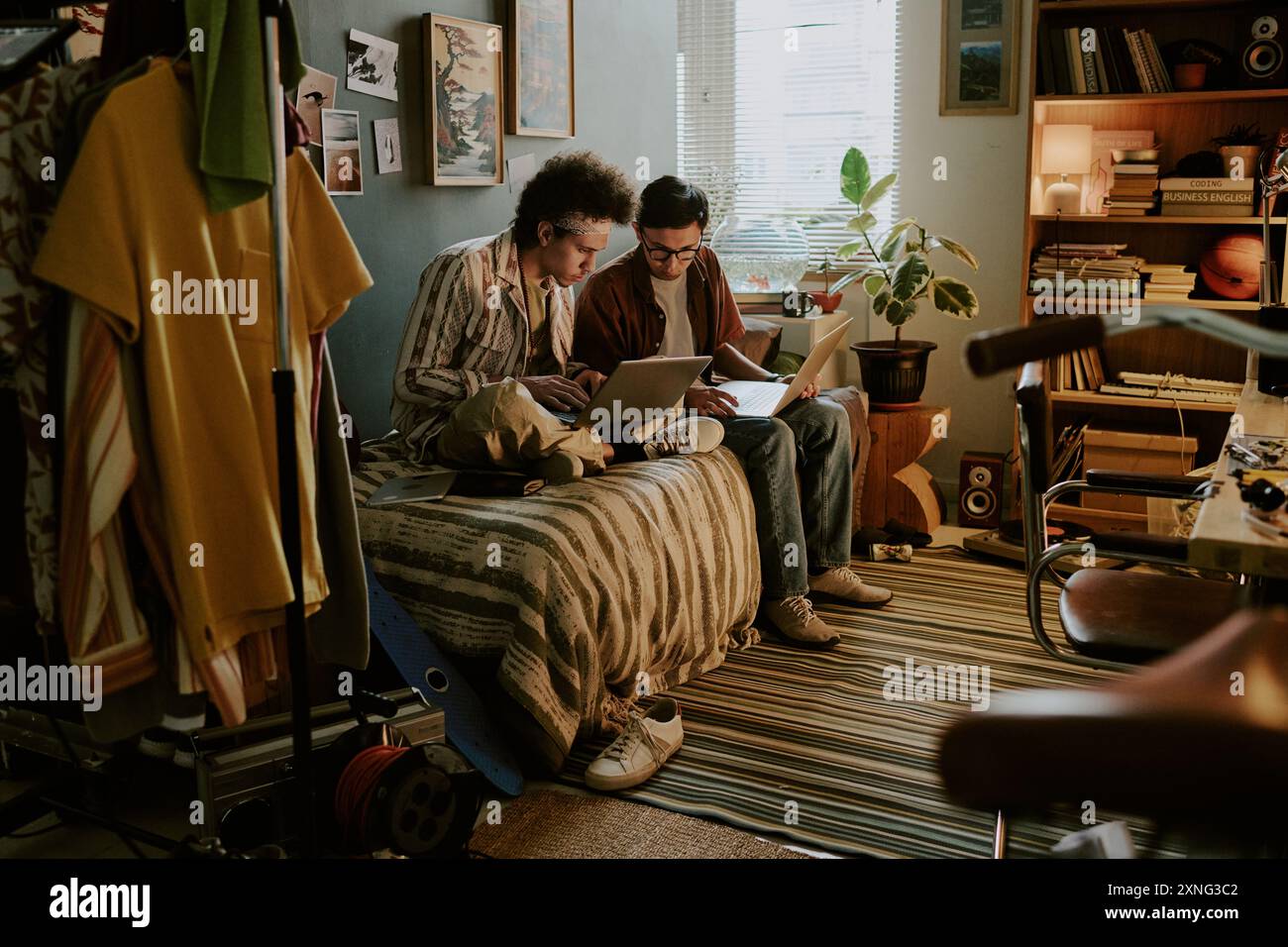 University students sitting on bed and comparing different databases