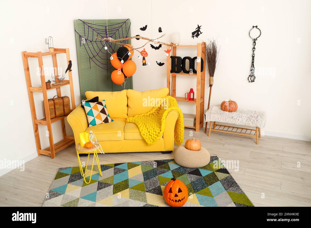 Interior of living room decorated for Halloween with sofa and shelf ...