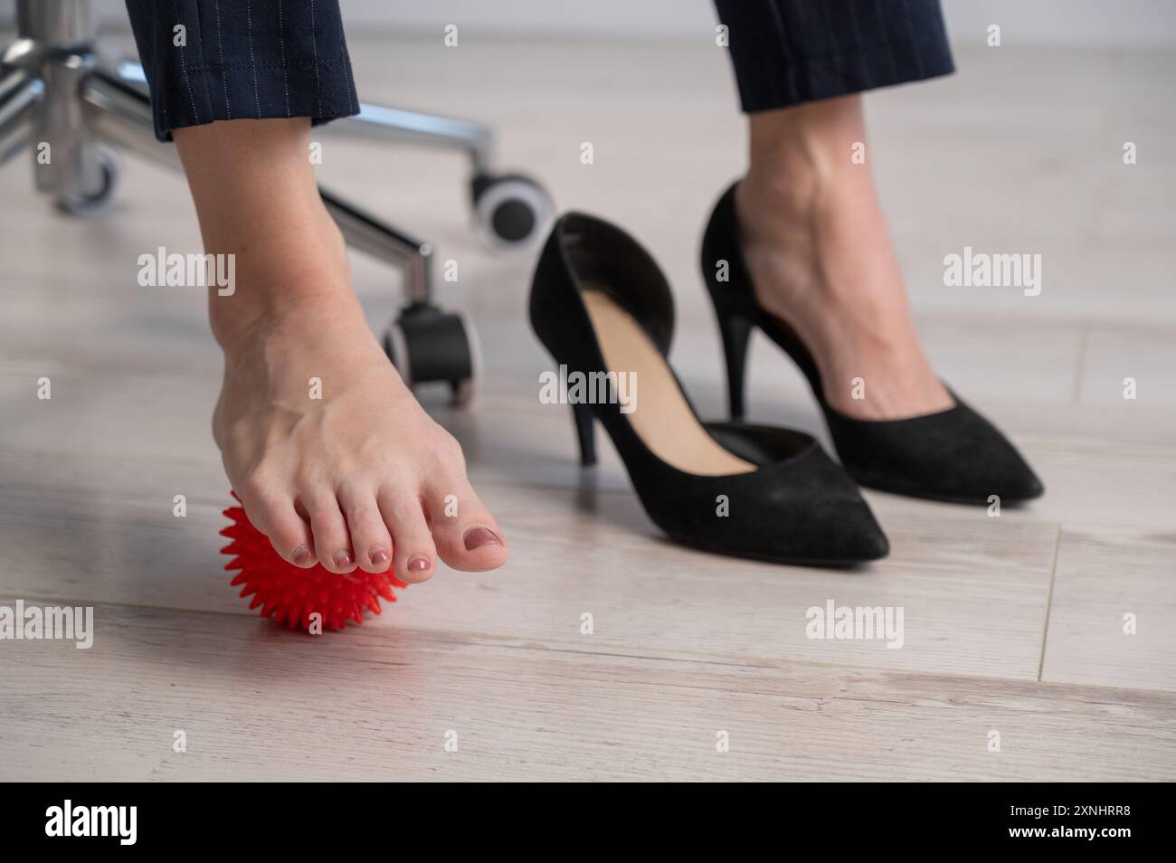 Business woman touching feet hi-res stock photography and images - Alamy