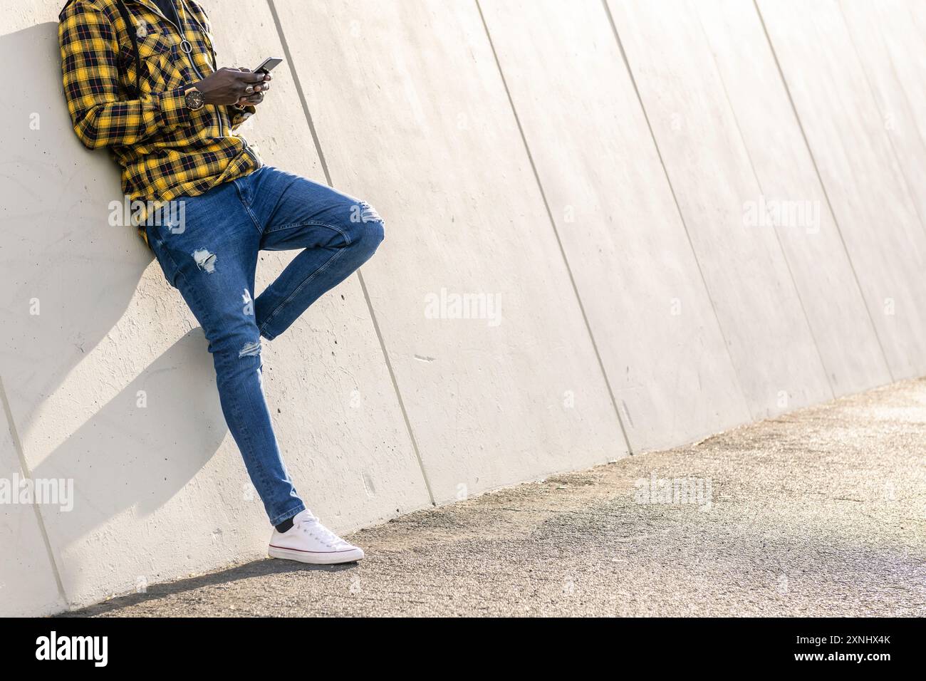 unrecognizable man writing a message at phone Stock Photo