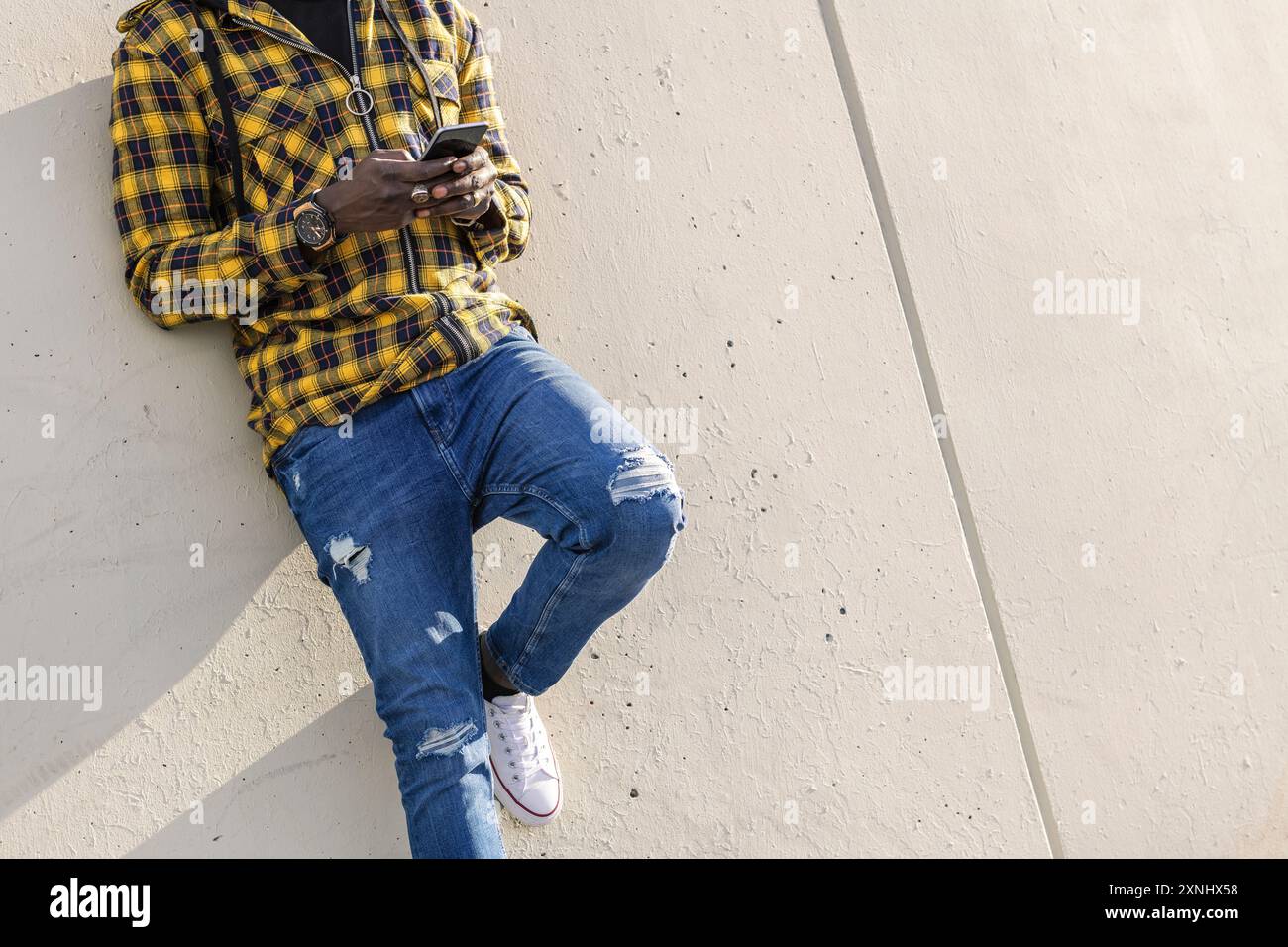 unrecognizable man writing a message on his phone Stock Photo