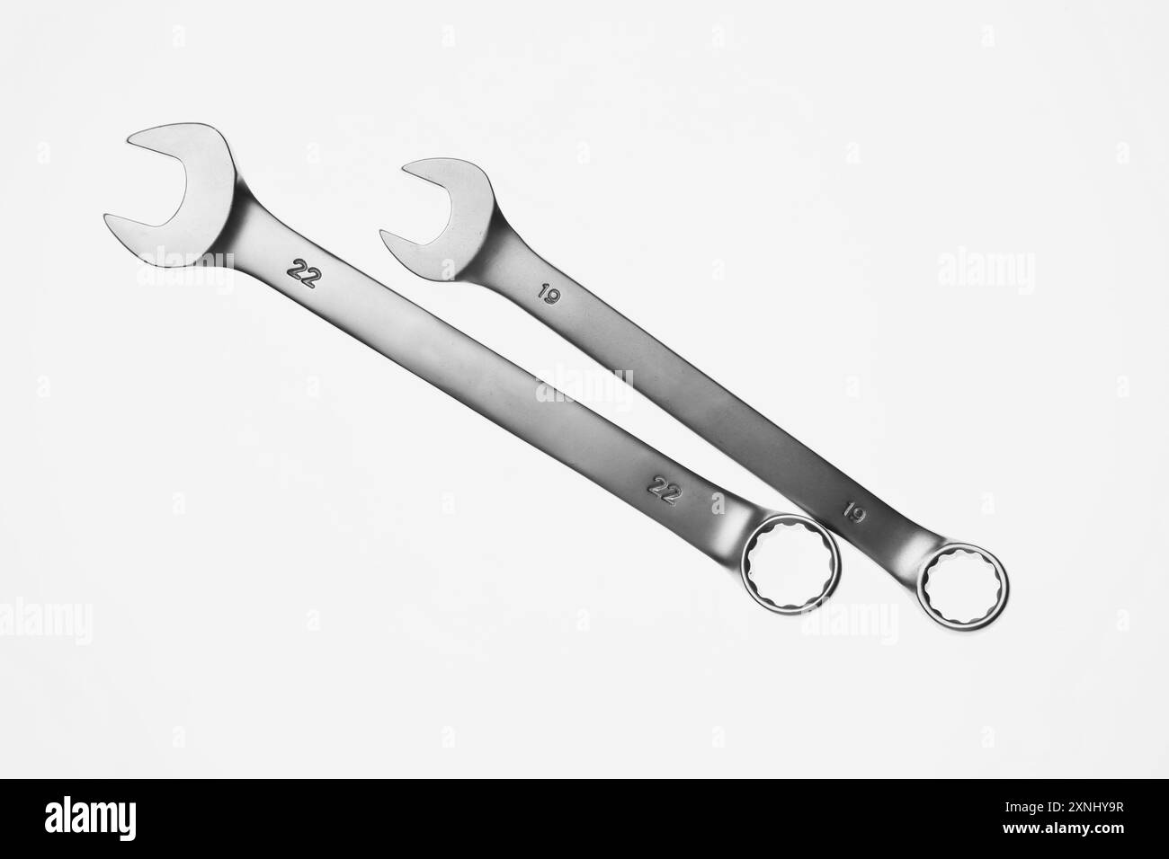Two ratcheting wrenches on white background, top view. Auto mechanic ...