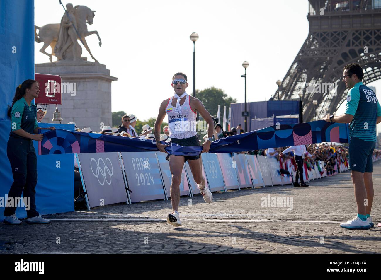 Brian Daniel Pintado, of Ecuador, crosses the finish line to win the ...